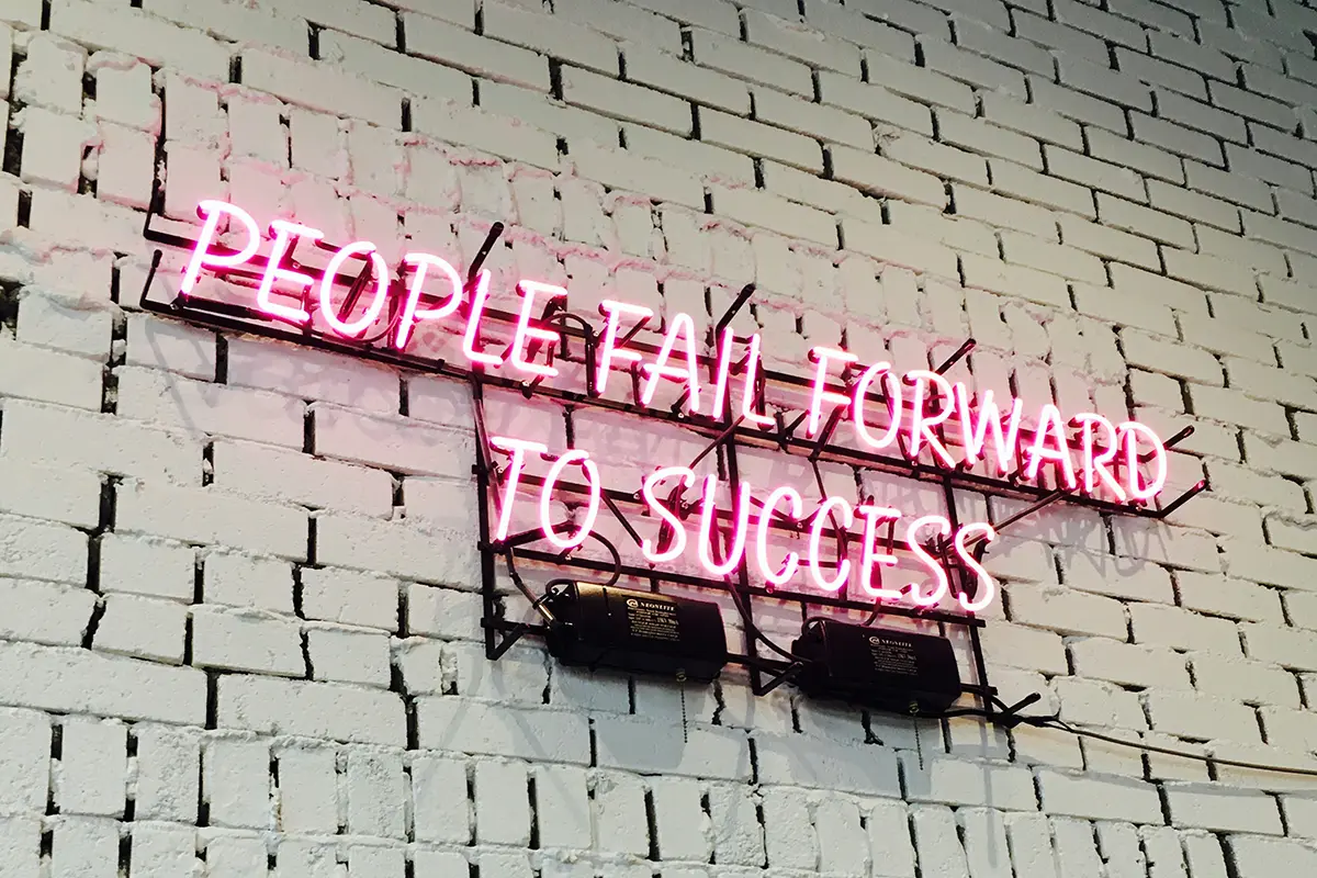 people fail forward to success neon sign